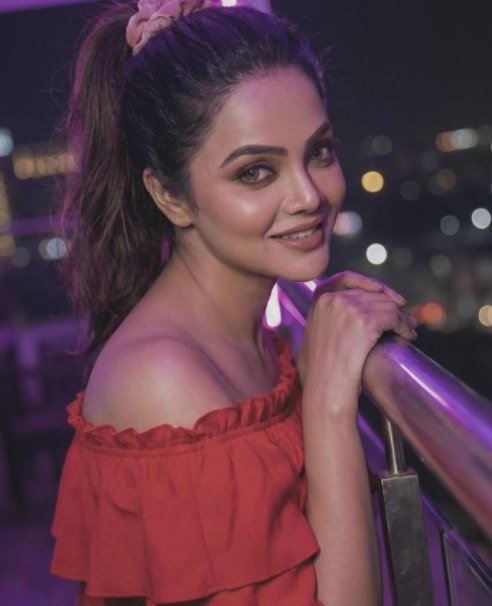 Tanvi at night with city lights